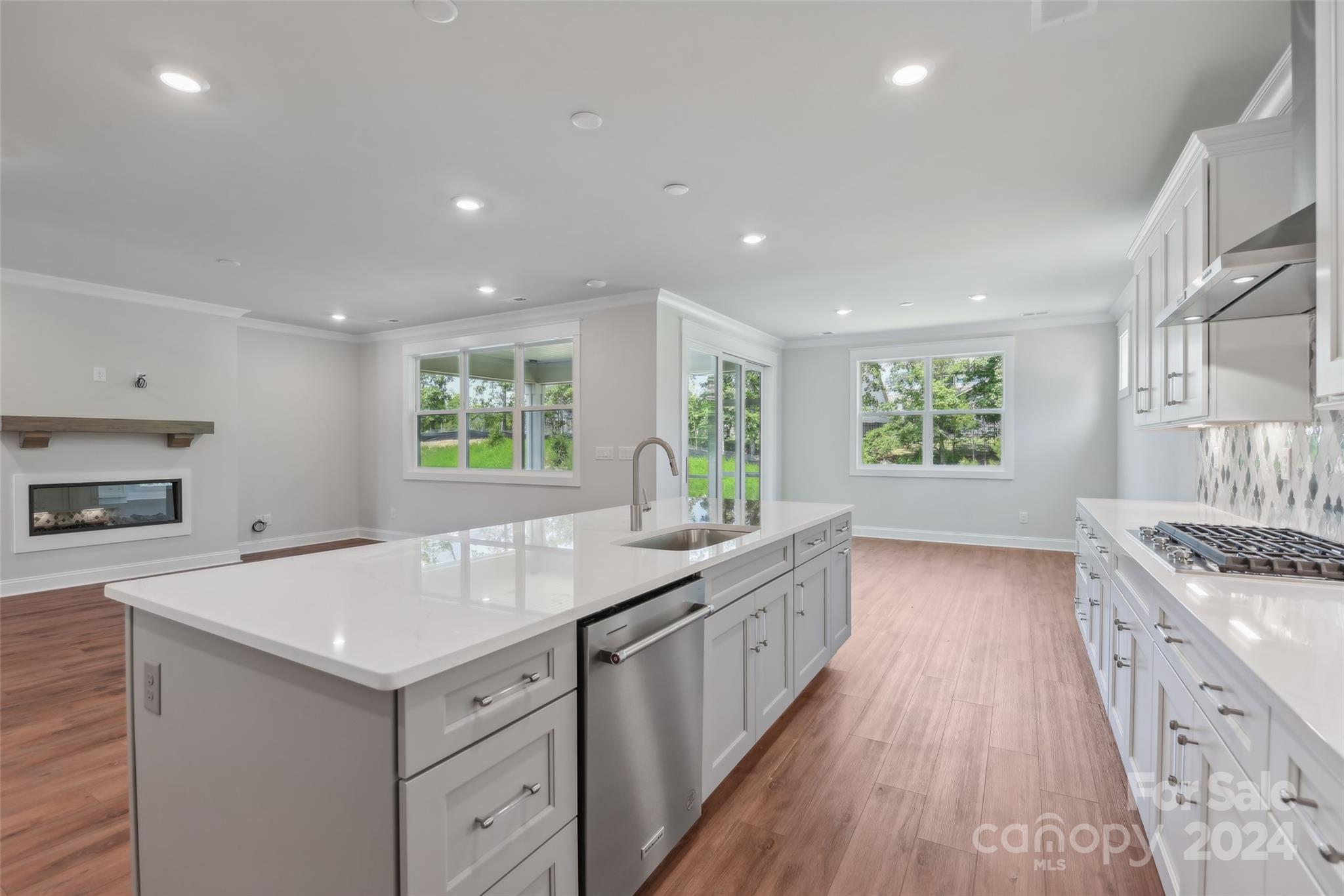 142 Windy Dell Drive Tega Cay, SC 29708 - Photo 7 of 20 a kitchen with a stove and a sink