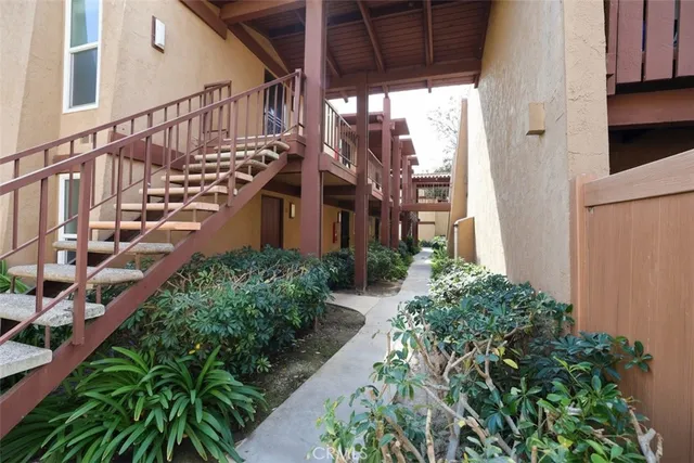 a view of a pathway of a house with wooden floor