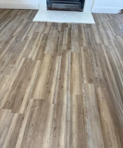 a view of outdoor space with wooden floor