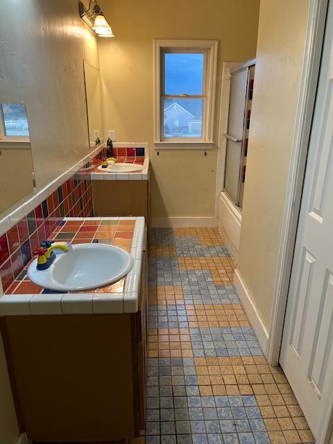 9537 Wamble Road Oakdale, CA 95361 - Photo 22 of 29 a bathroom with a sink a toilet a mirror and vanity