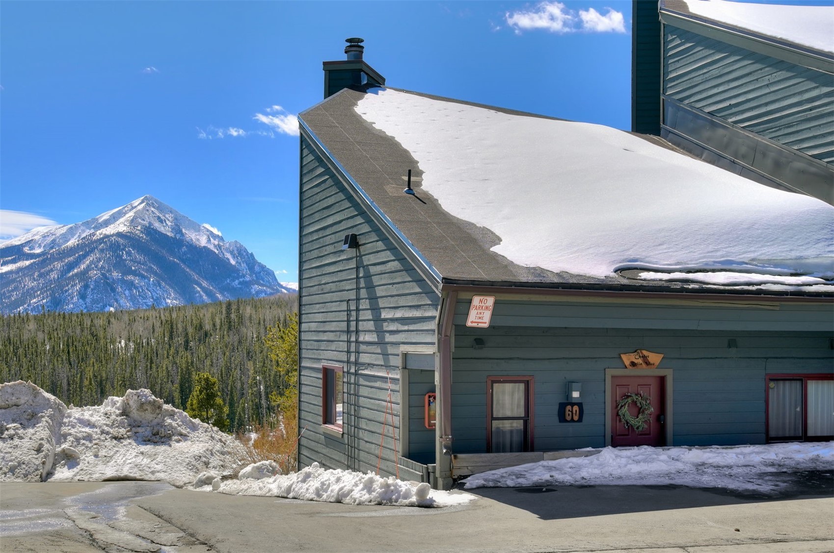 9460 Ryan Gulch Road, Unit 9460 Silverthorne, CO 80498 - Photo 34 of 39 a front view of a house with a garage