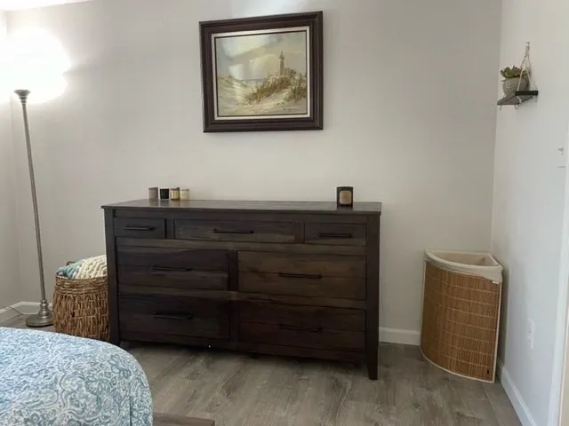 a bedroom with a bed and a dresser