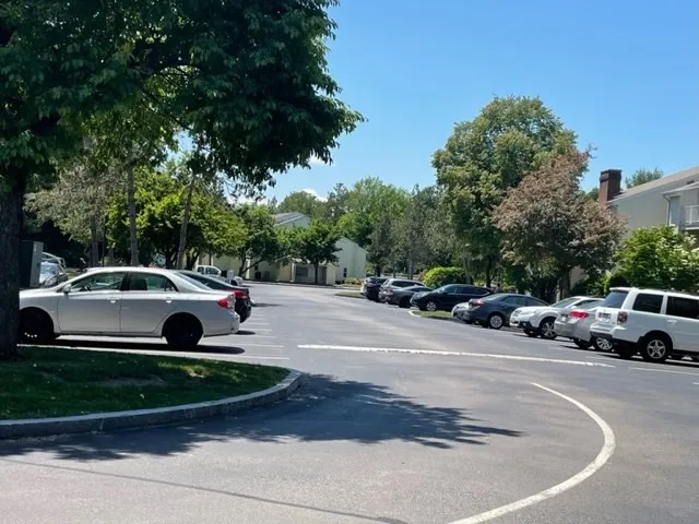 a view of street with parked cars