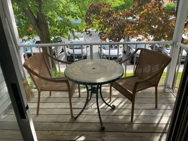 a view of balcony with furniture