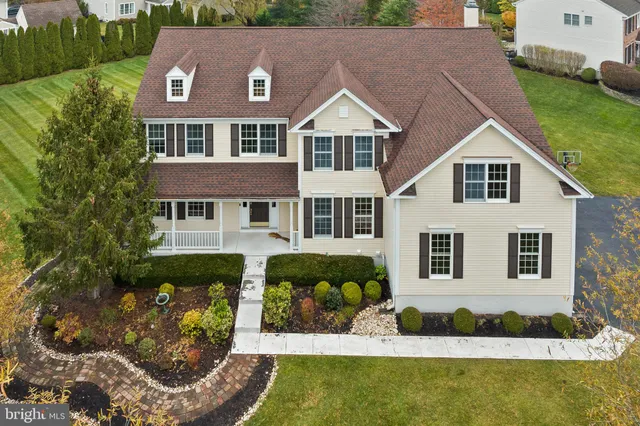 a aerial view of a house with a yard