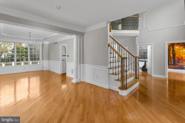 a large kitchen with stainless steel appliances granite countertop a stove a sink dishwasher and a refrigerator