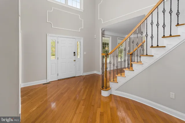 a view of an entryway with wooden floor
