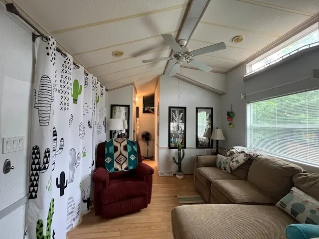 a living room with furniture and a window