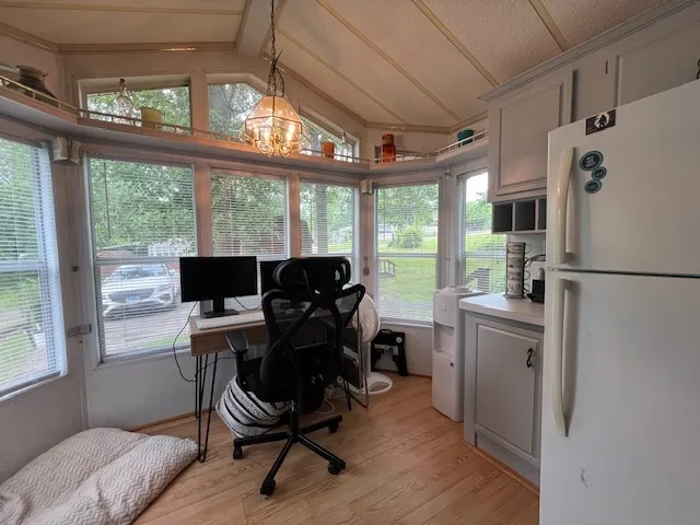 a kitchen with a sink appliances cabinets and furniture