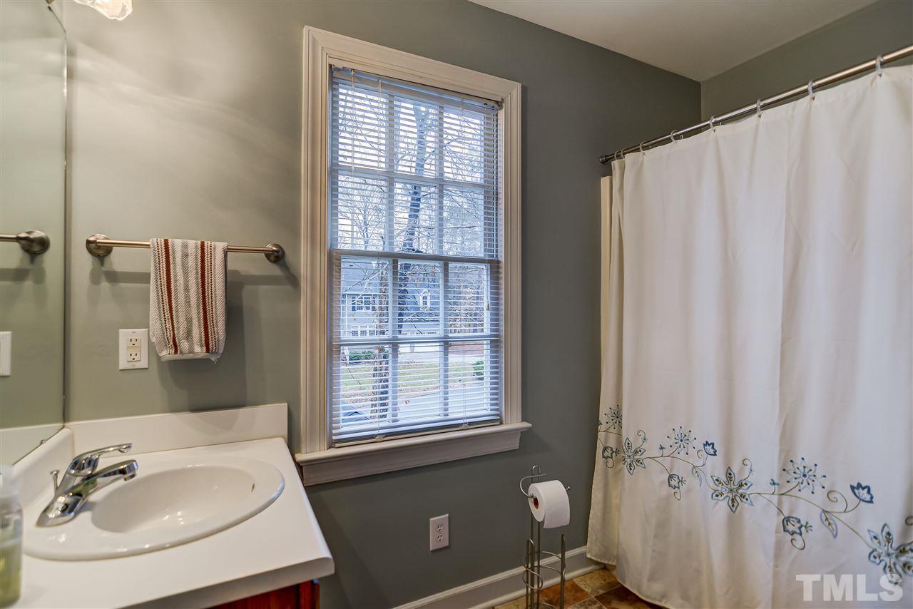 5121 Celbridge Place Raleigh, NC 27613 - Photo 17 of 22 a bathroom with a sink toilet and shower