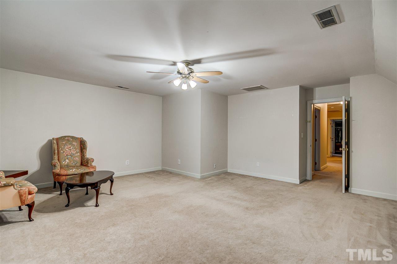 5121 Celbridge Place Raleigh, NC 27613 - Photo 20 of 22 a view of workspace with furniture and chandelier fan