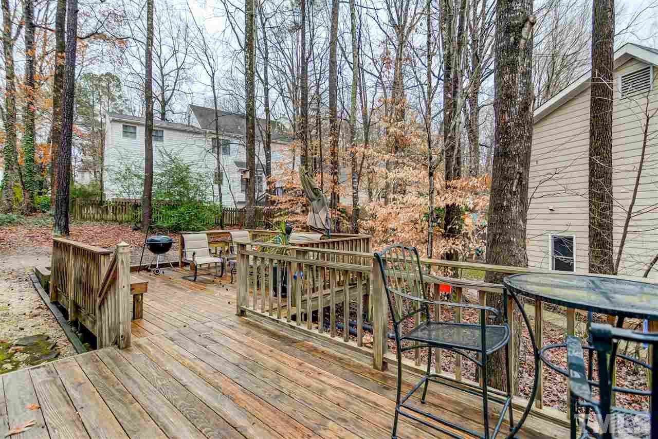 5121 Celbridge Place Raleigh, NC 27613 - Photo 21 of 22 a view of balcony with chairs and wooden floor