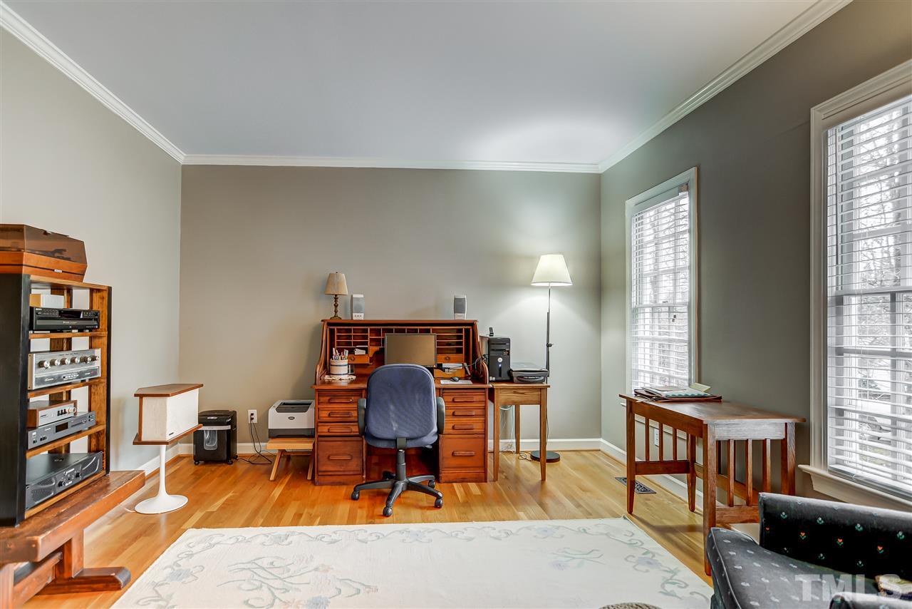 5121 Celbridge Place Raleigh, NC 27613 - Photo 4 of 22 a living room with furniture a rug and a window