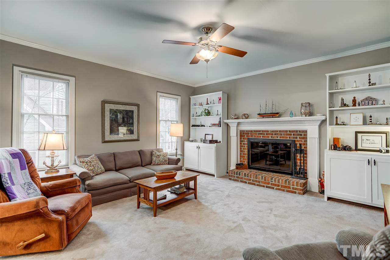 5121 Celbridge Place Raleigh, NC 27613 - Photo 6 of 22 a living room with furniture and a fireplace