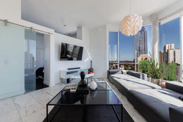 a living room with furniture and a flat screen tv
