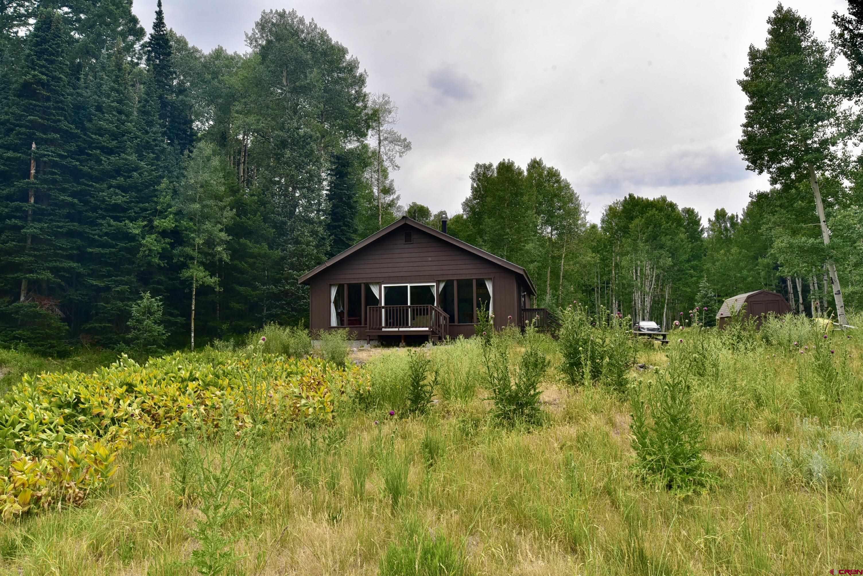 704 Hampton Road Montrose, CO 81220 - Photo 29 of 45 a view of a barn in the middle of a yard