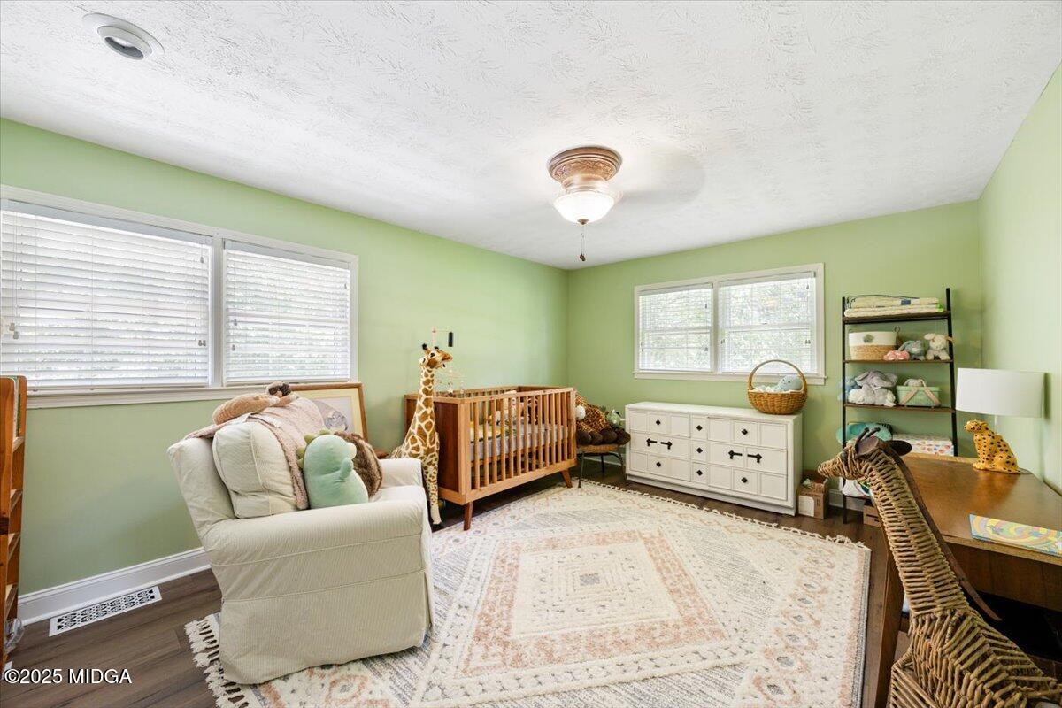 1414 Park Avenue Perry, GA 31069 - Photo 17 of 37 a bedroom with furniture and a large window