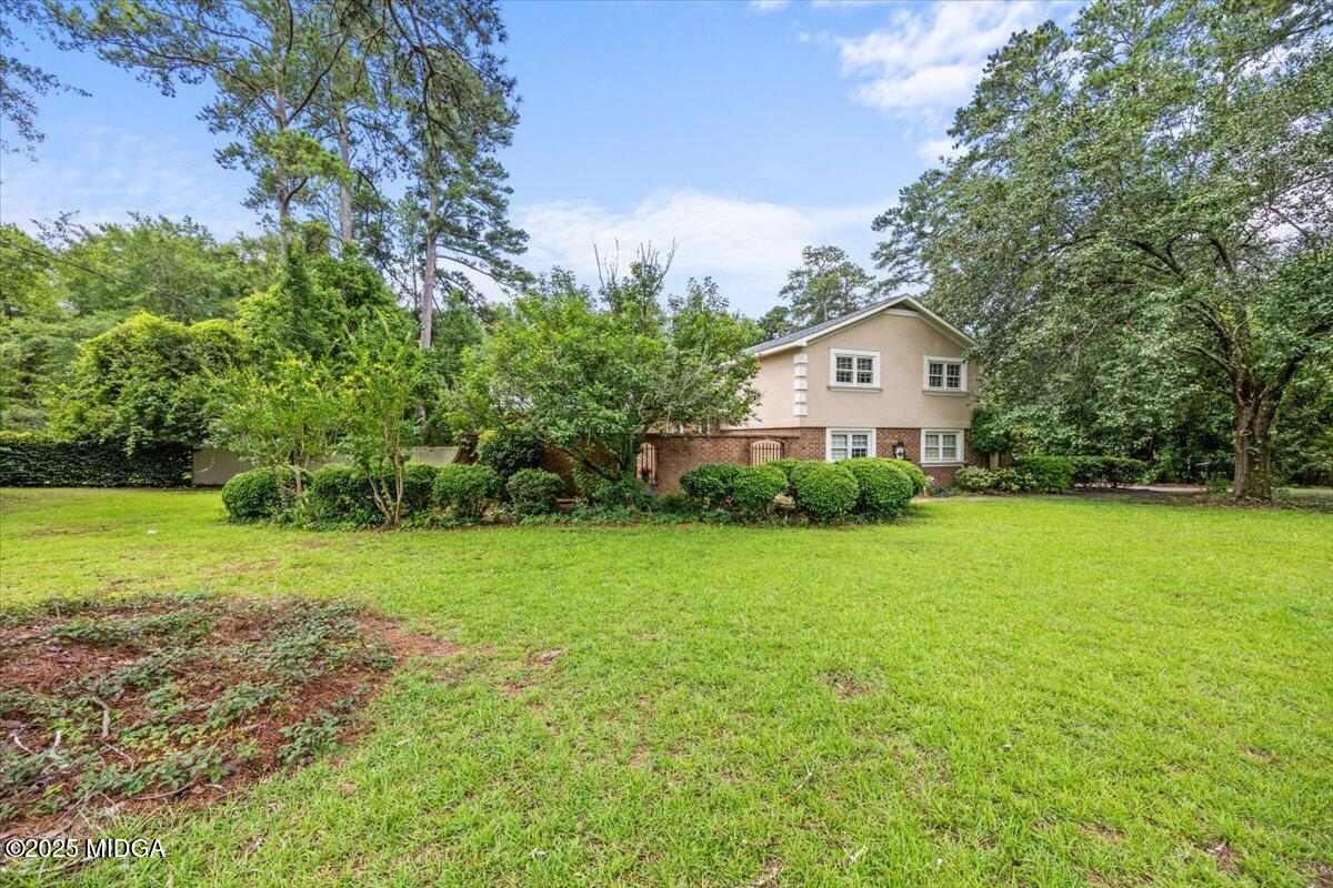 1414 Park Avenue Perry, GA 31069 - Photo 2 of 37 a view of a house with a yard and sitting area