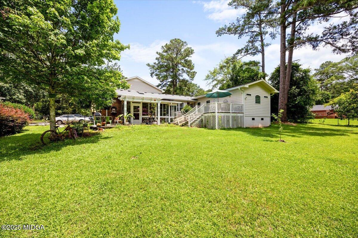 1414 Park Avenue Perry, GA 31069 - Photo 32 of 37 a view of a house with a big yard and large trees