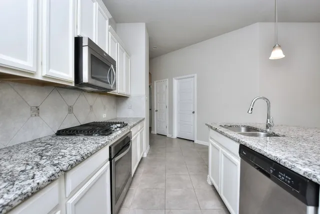 a view of livingroom with window fireplace and hardwood floor