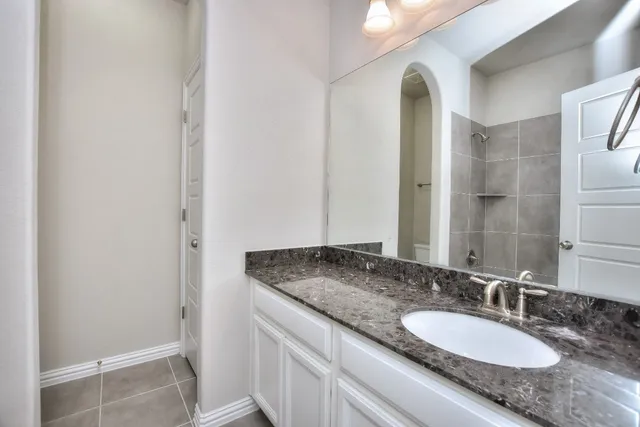 a bath tub sitting next to a white sink