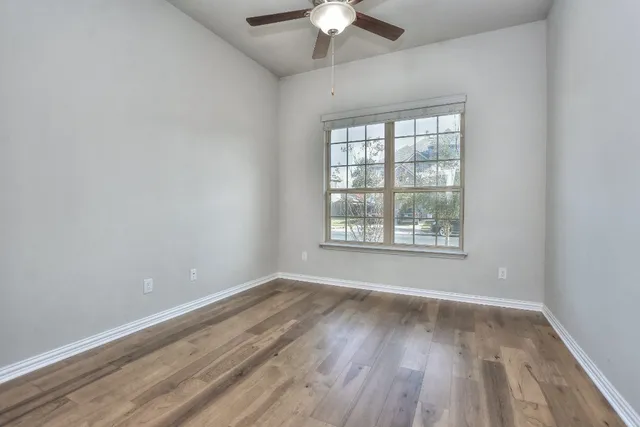 a bathroom with a sink toilet and mirror