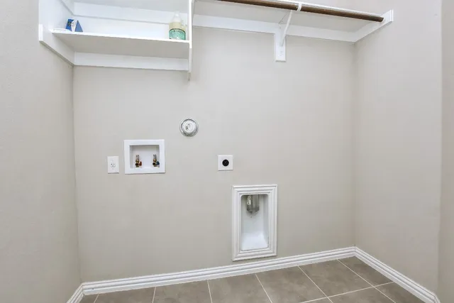 a kitchen with kitchen island stainless steel appliances a sink stove and refrigerator