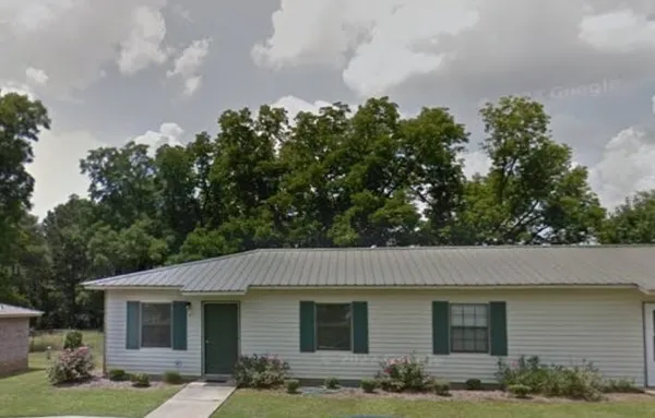 a view of a yard in front of a house