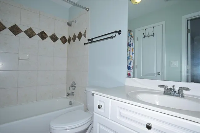 a bathroom with a sink a toilet and a bathtub