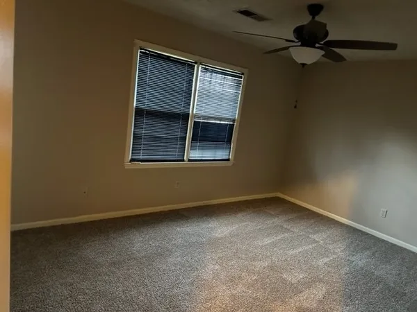 a bathroom with a shower and a toilet
