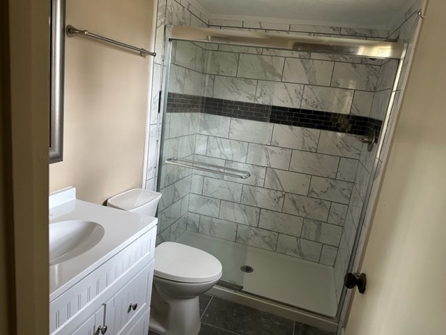 4037 Curry Street Columbus, GA 31907 - Photo 12 of 14 a bathroom with a shower and a toilet