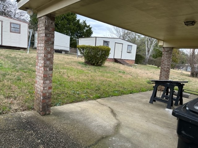 4037 Curry Street Columbus, GA 31907 - Photo 14 of 14 a view of a chairs and table in the backyard