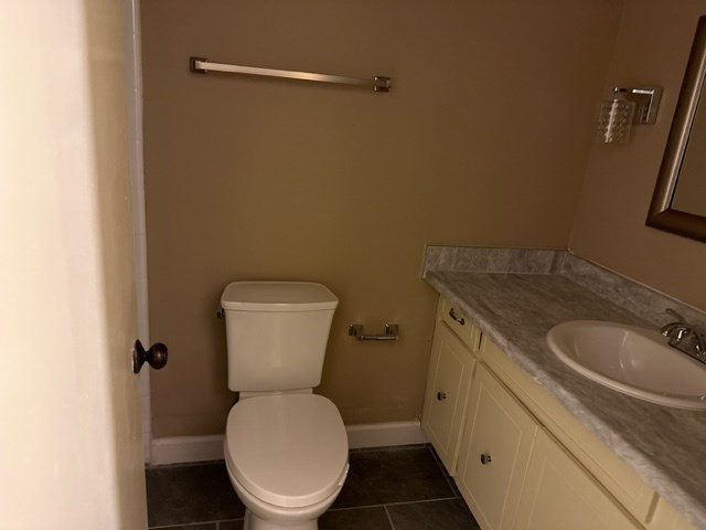 4037 Curry Street Columbus, GA 31907 - Photo 9 of 14 a bathroom with a toilet sink and mirror
