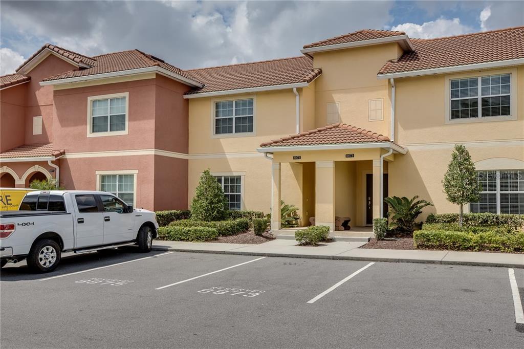 8875 Candy Palm Road Kissimmee, FL 34747 - Photo 1 of 1 a car parked in front of a house