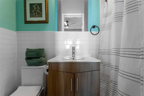 a bathroom with a sink and mirror