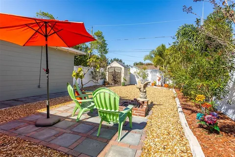 a view of a chairs and table in the patio