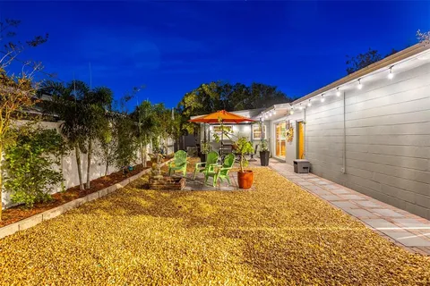 a view of a backyard of the house