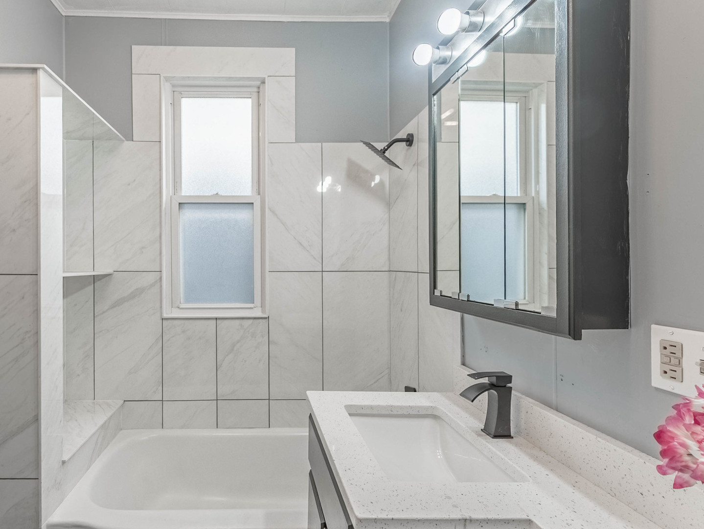 7041 South Throop Street Chicago, IL 60636 - Photo 11 of 36 a bathroom with a bathtub and shower