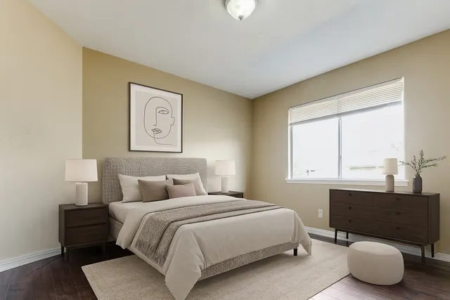 a bedroom with a bed and window