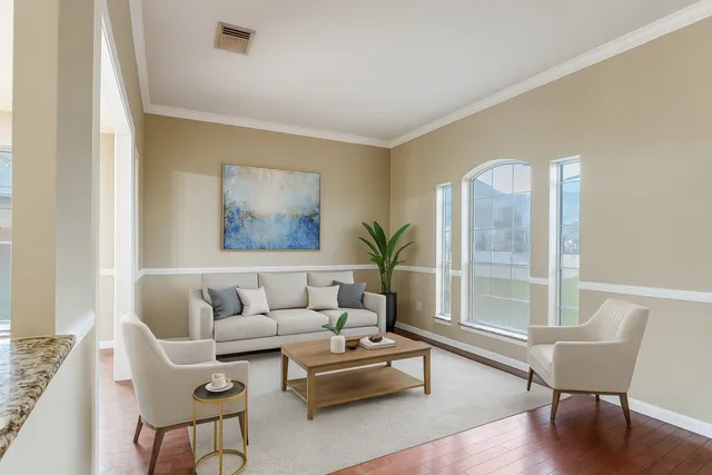 a living room with furniture and a large window