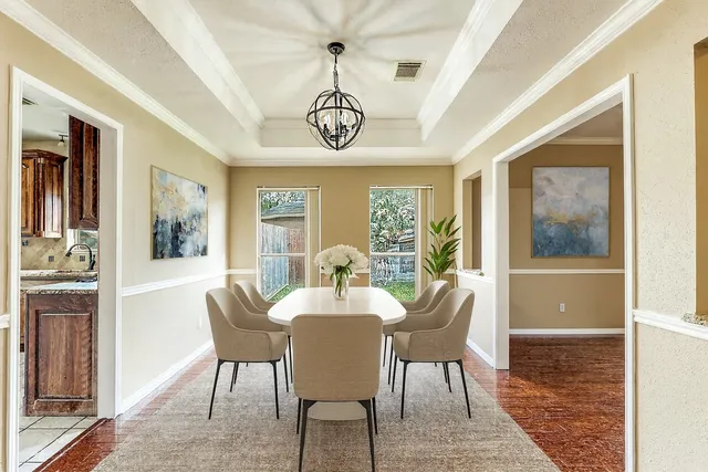 a view of a dining room with furniture window and wooden floor