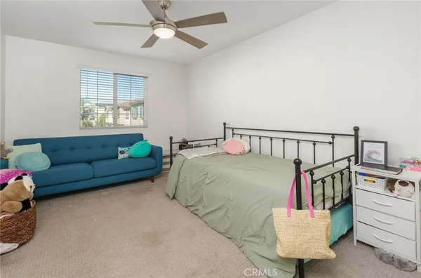 a bedroom with furniture and a window