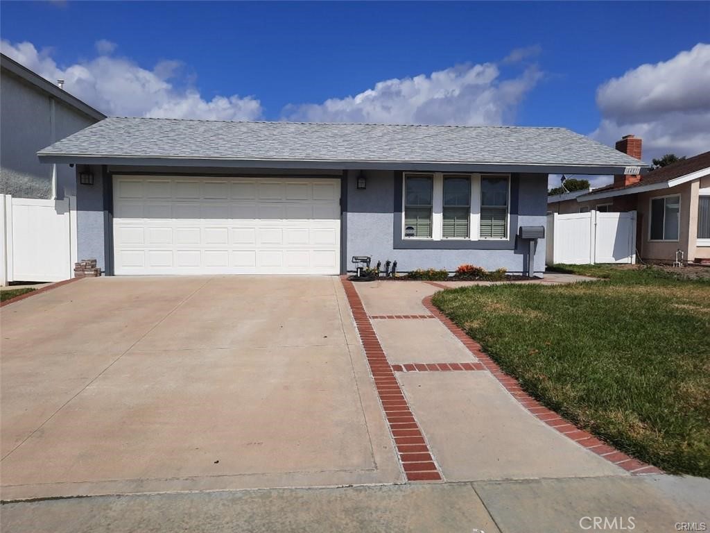 4481 Wyngate Circle Irvine, CA 92604 - Photo 1 of 42 a front view of a house with a yard