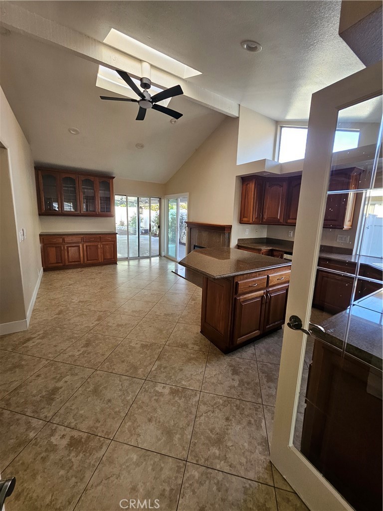 4481 Wyngate Circle Irvine, CA 92604 - Photo 13 of 42 a kitchen with a stove a microwave and white cabinets