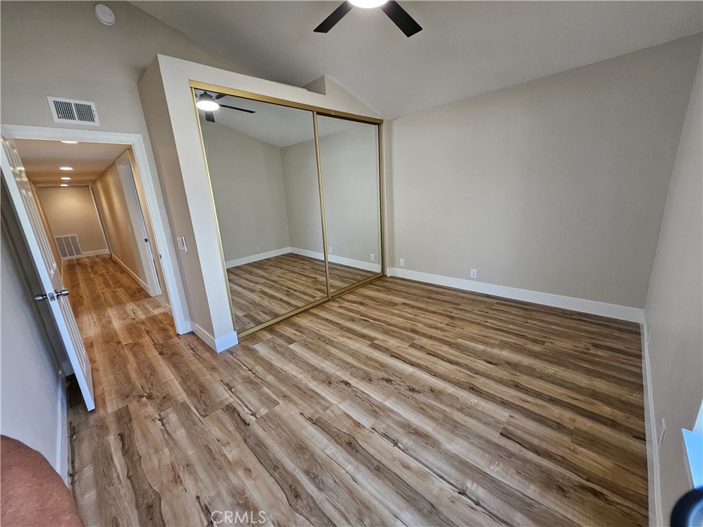 4481 Wyngate Circle Irvine, CA 92604 - Photo 24 of 42 a view of a room with wooden floor and staircase