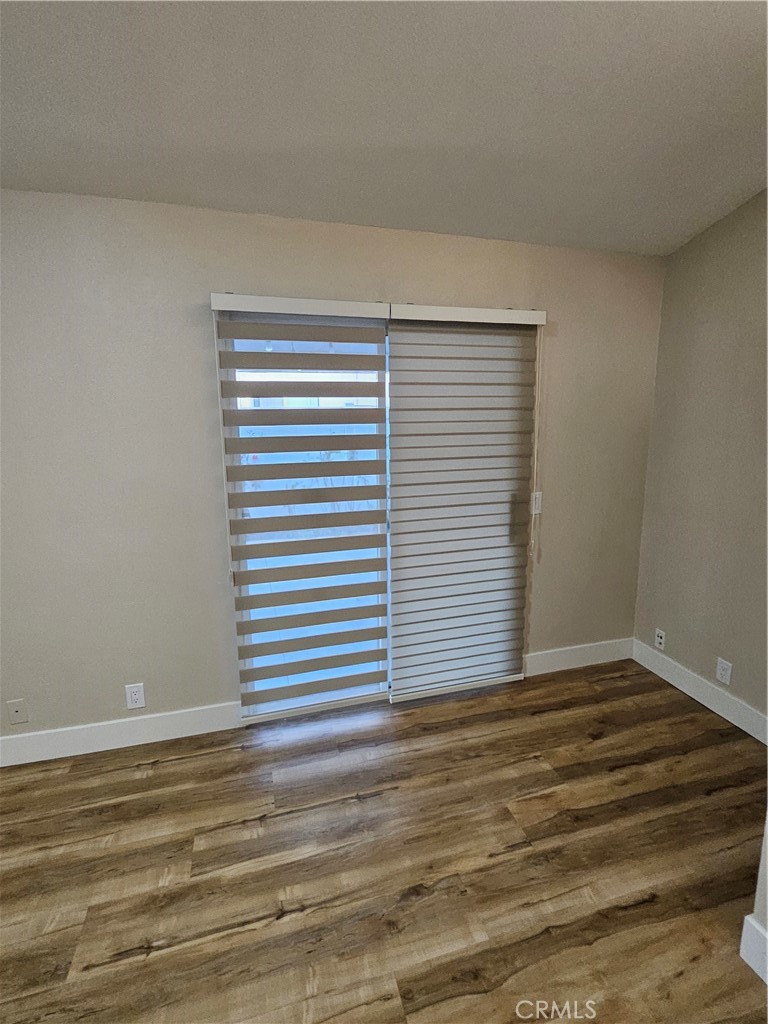 4481 Wyngate Circle Irvine, CA 92604 - Photo 28 of 42 a view of a room with a wooden floor and a window