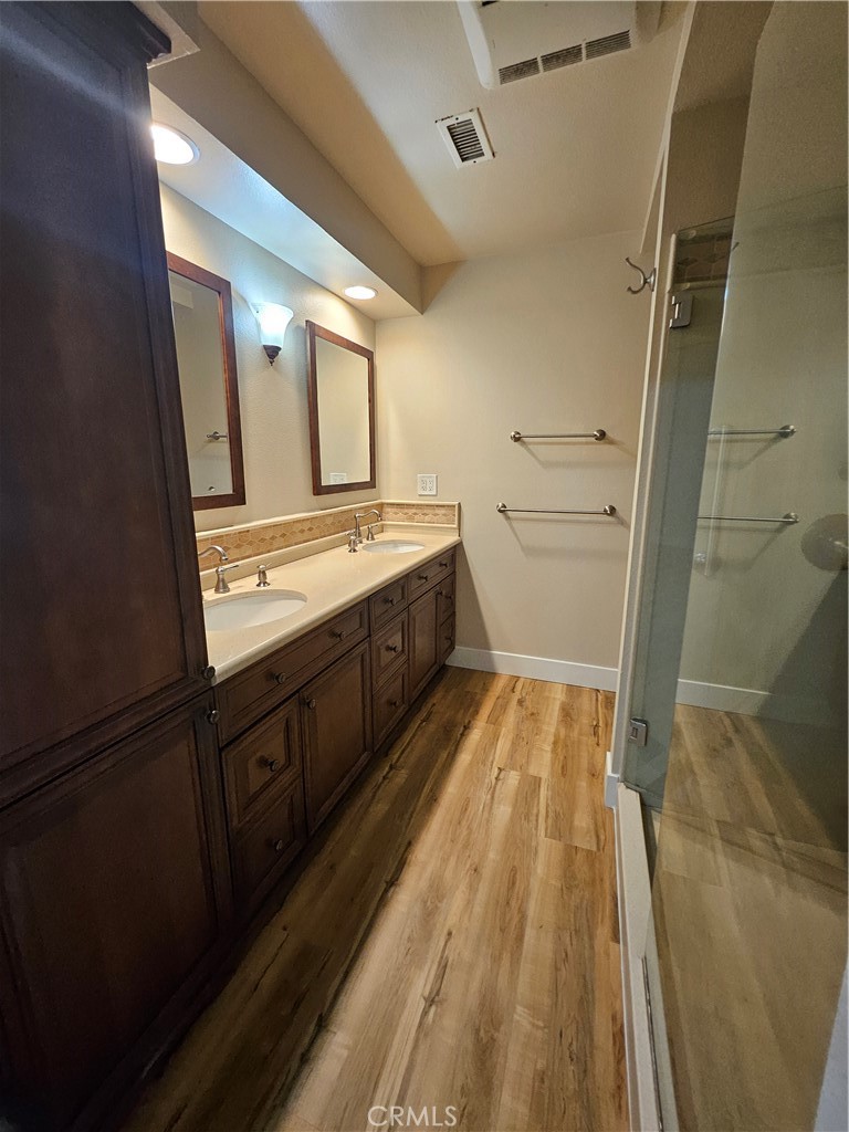 4481 Wyngate Circle Irvine, CA 92604 - Photo 29 of 42 a bathroom with sink a vanity and a mirror