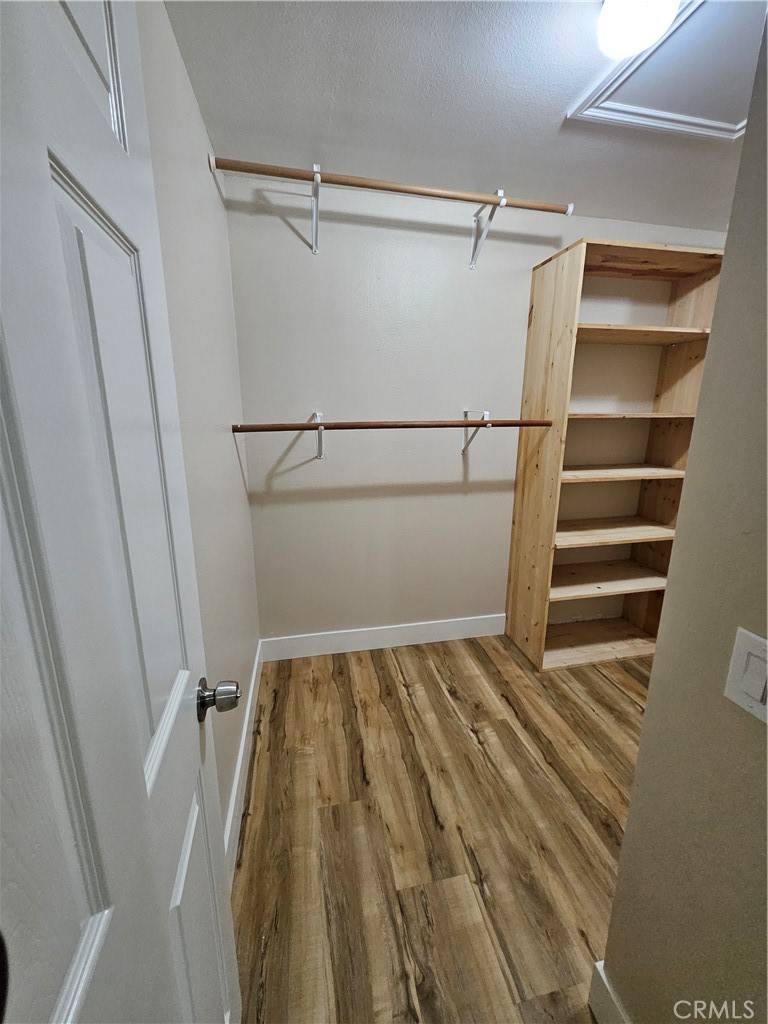 4481 Wyngate Circle Irvine, CA 92604 - Photo 32 of 42 a view of walk in closet with empty racks