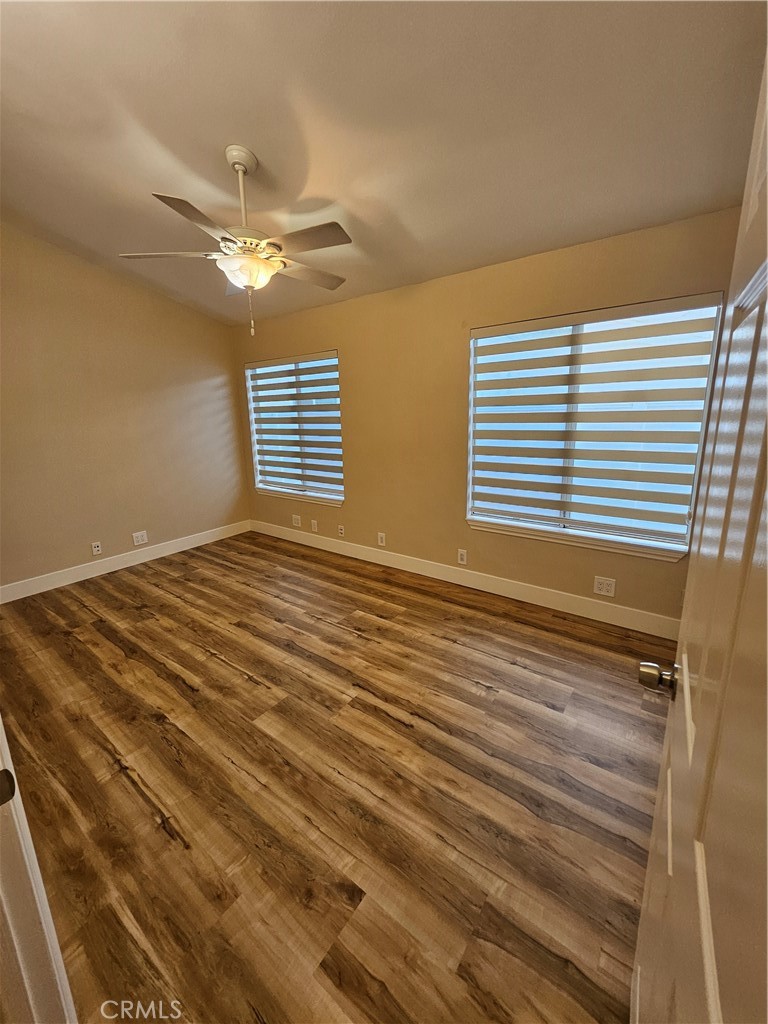 4481 Wyngate Circle Irvine, CA 92604 - Photo 33 of 42 a view of a room with wooden floor and fan