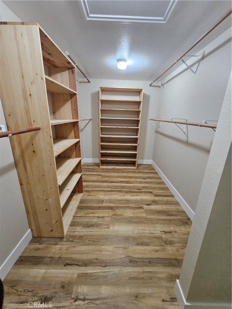 4481 Wyngate Circle Irvine, CA 92604 - Photo 34 of 42 a view of walk in closet with empty racks